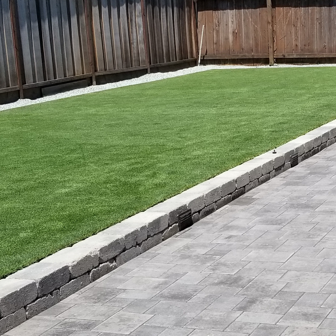 Artificial Grass with Stone Barrier